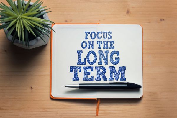 Tablet with "Focus on the Long Term" written on it